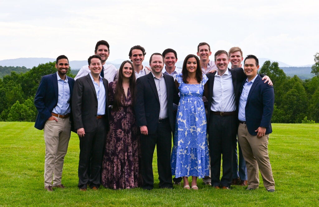 12 Members of the 2025 DR Graduating Class pose for a group portrait