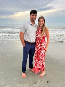 Taylor Seeland with partner on beach