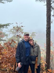 Daniel Edmund with partner in woods
