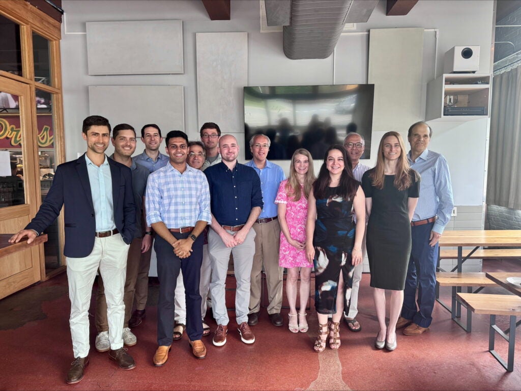 IR graduates and faculty pose for a group photo