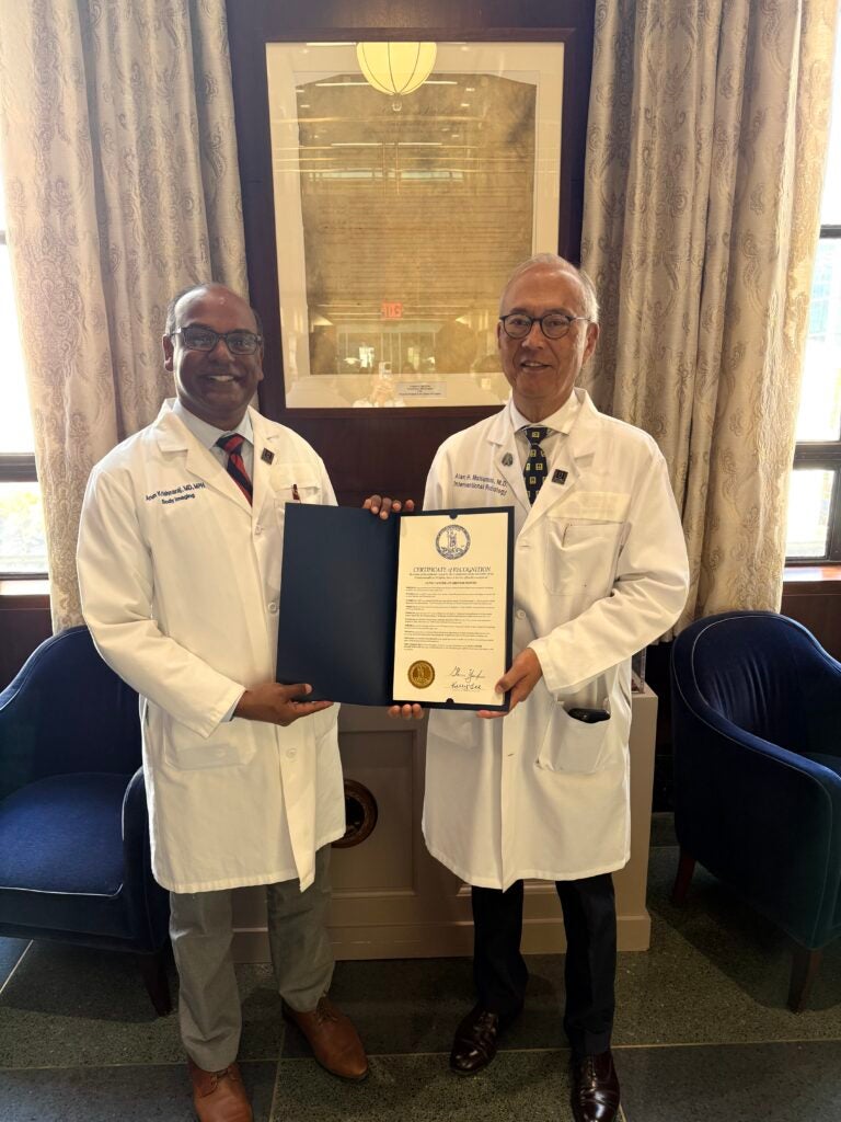 Arun Krishnaraj and Alan Matsumoto posing with proclamation