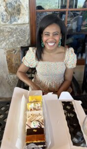 Dr. Lattimore with dessert at dinner table