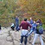 students enjoying a view at the top after hiking 2