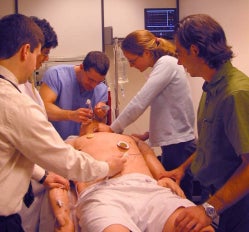 Photo of students practicing the medical management of many toxicological conditions using the human patient simulator.