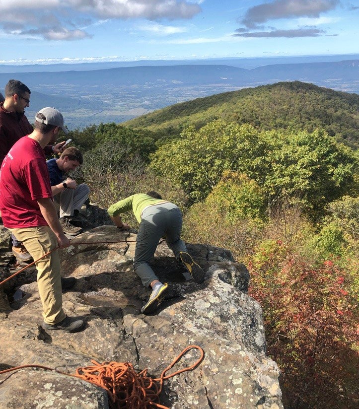 Rotators learning wilderness rescue techniques against the beautiful backdrop of the local Blue Ridge Mountains