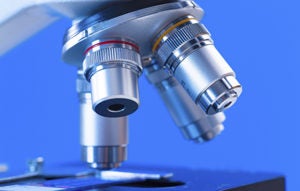 Image of a Microscope against blue background