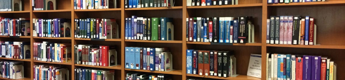 Banner image of colorful book spines on shelves