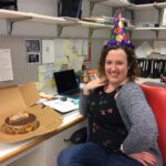 lab member with a birthday cake